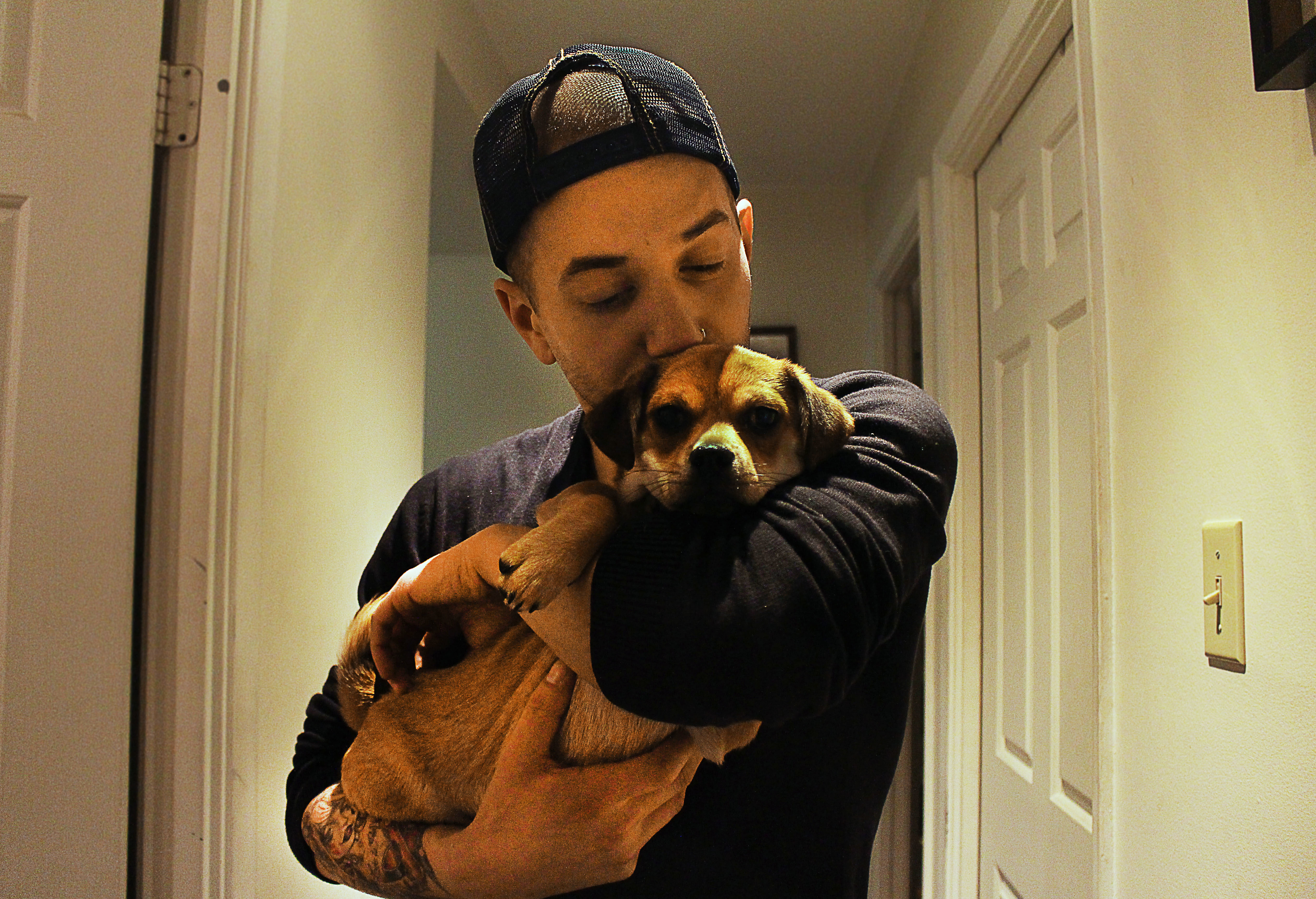 Matty Cameron holding a dog.